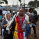 A Catholic sister and a Maasai woman arrive just after dawn to attend the papal mass in Nairobi.